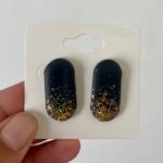 Black Capsule Glittery Studs