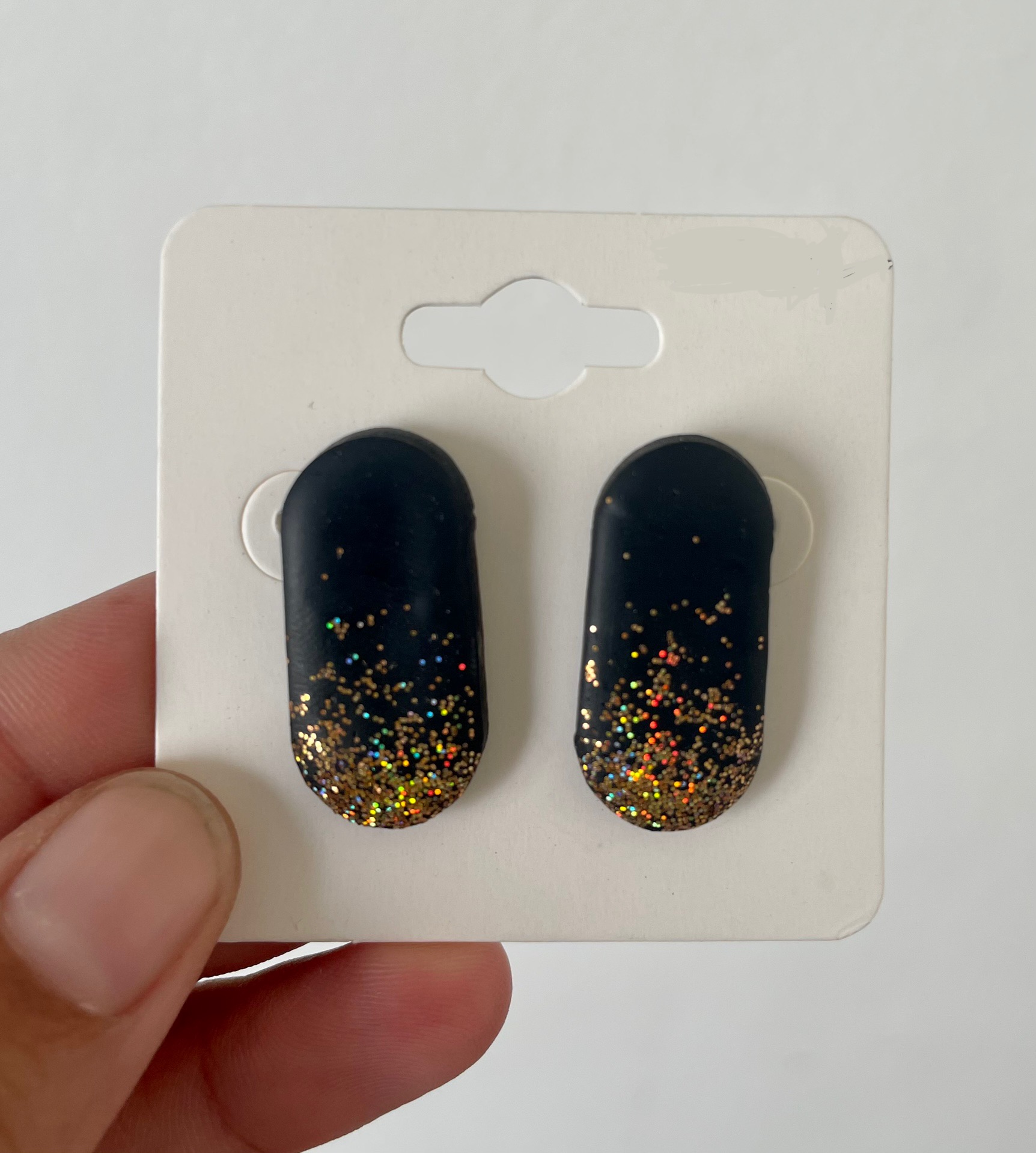 Black Capsule Glittery Studs